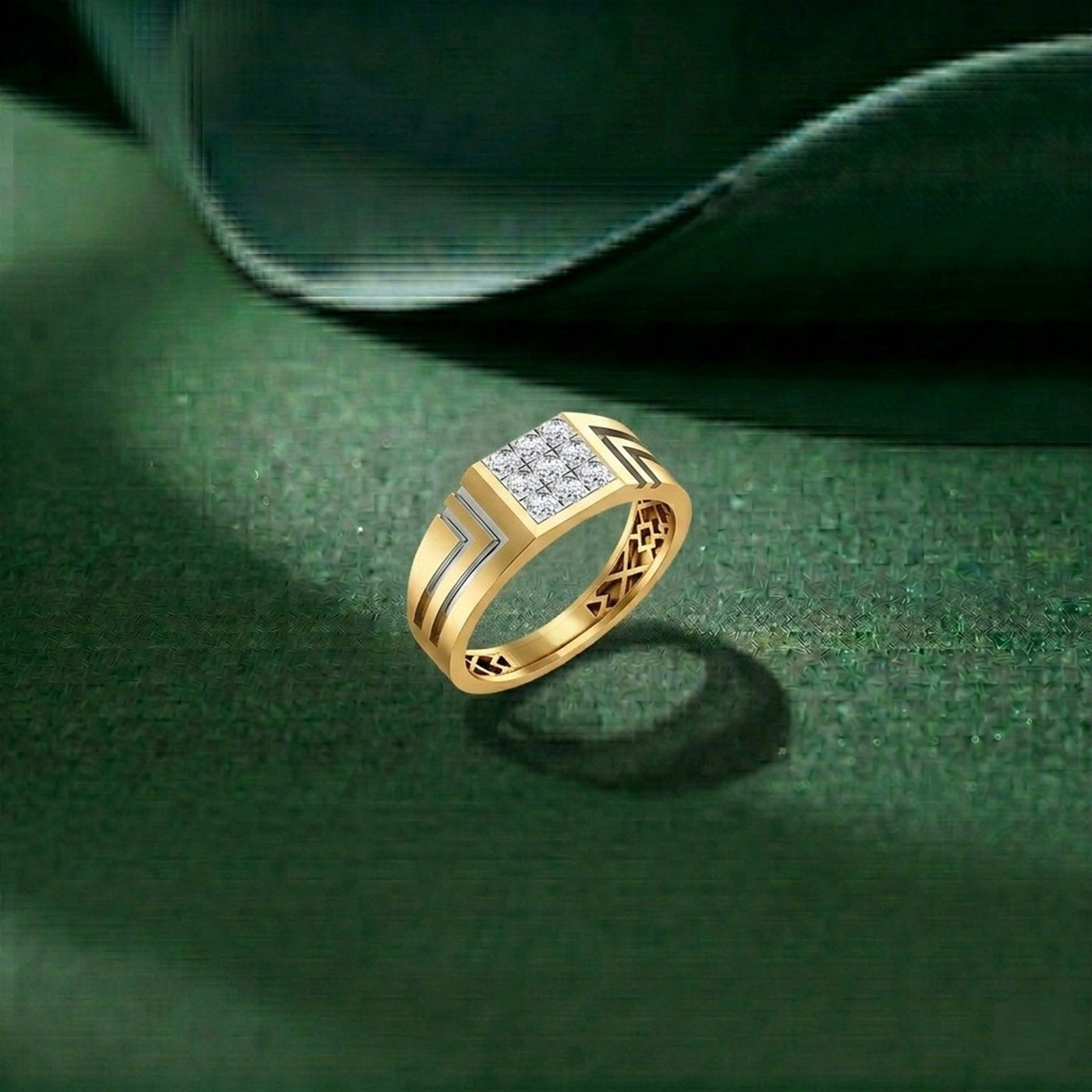 Gold ring with diamonds on a green leaf background