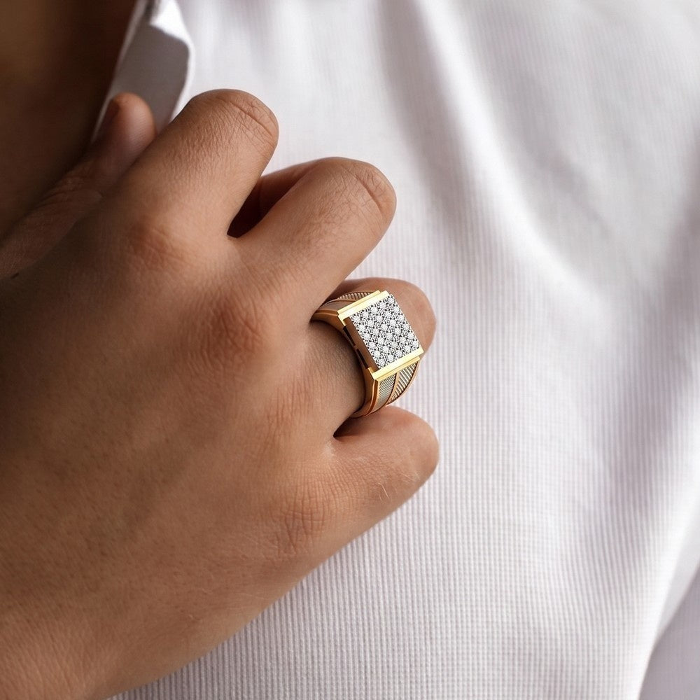 Gold ring with diamonds on a person's finger against a white background