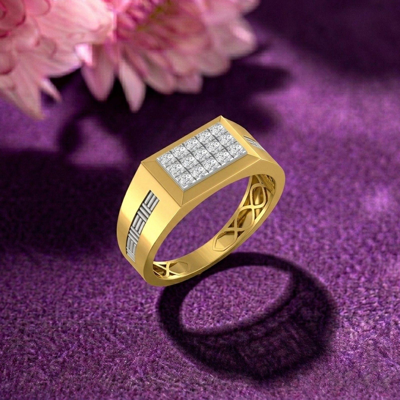 Gold ring with diamond accents on a purple textured surface with pink flowers.
