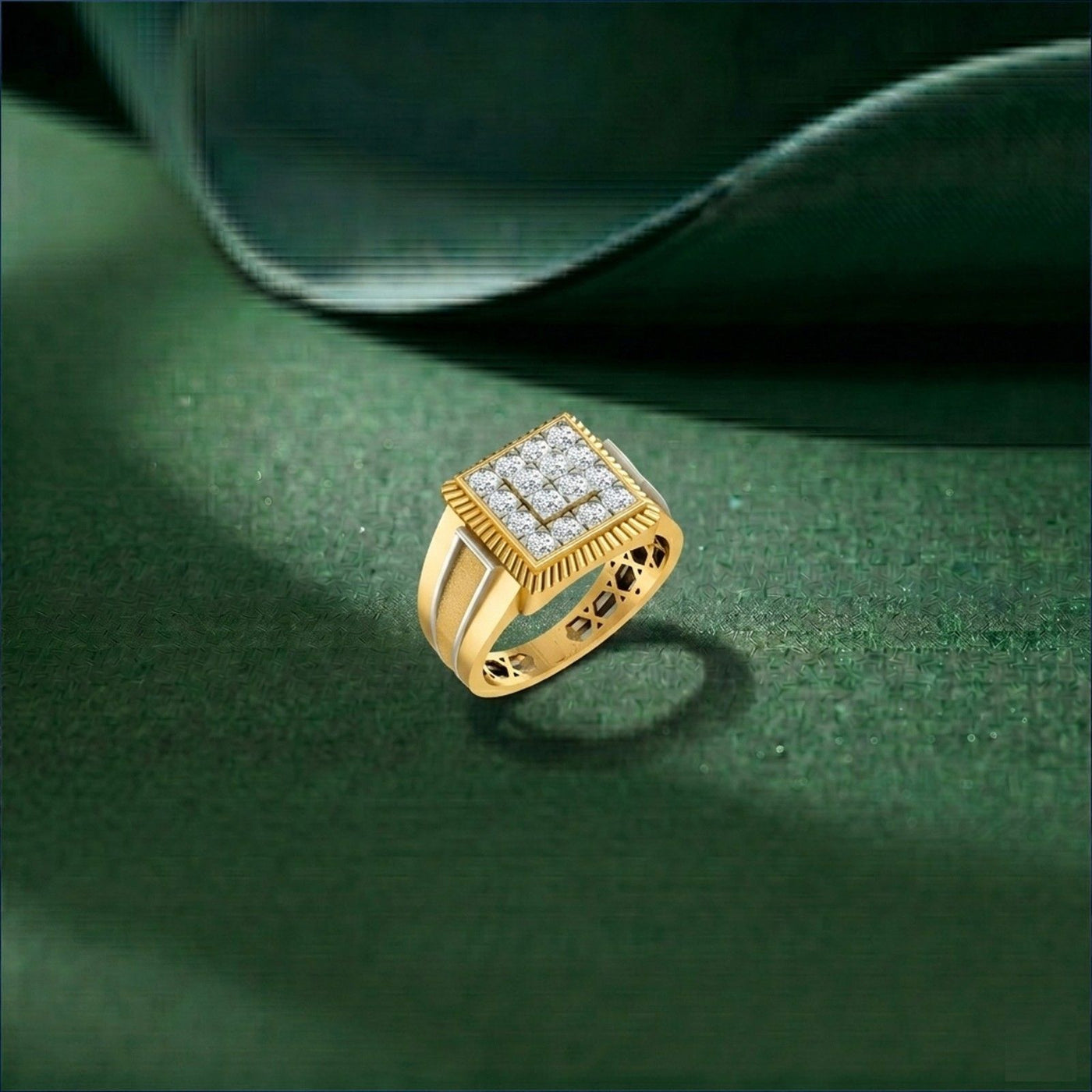 Gold ring with diamond accents on a green surface
