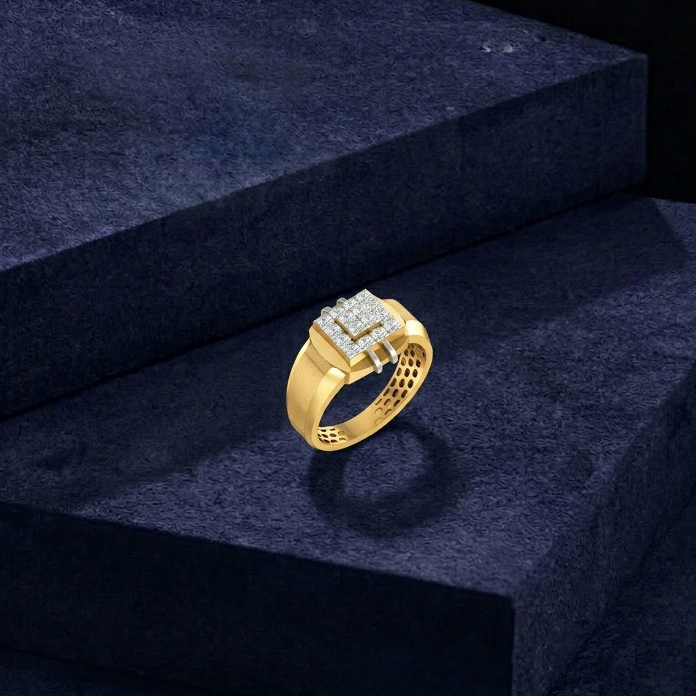 Gold ring with diamonds on a dark blue textured surface