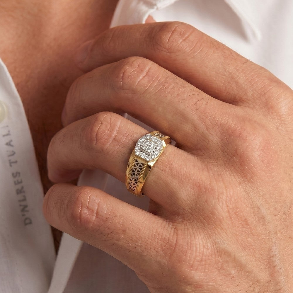 Close-up of a hand wearing a gold ring with diamonds on a white background