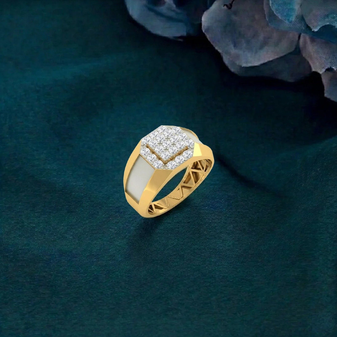 Gold ring with diamonds on a textured green surface
