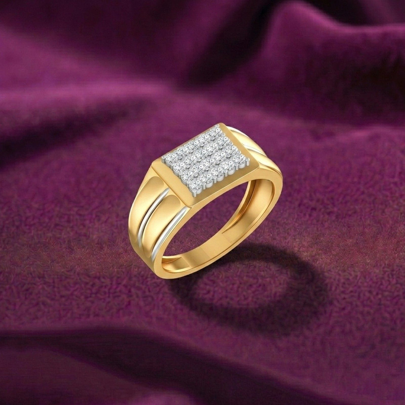 Gold ring with diamond accents on a purple fabric background