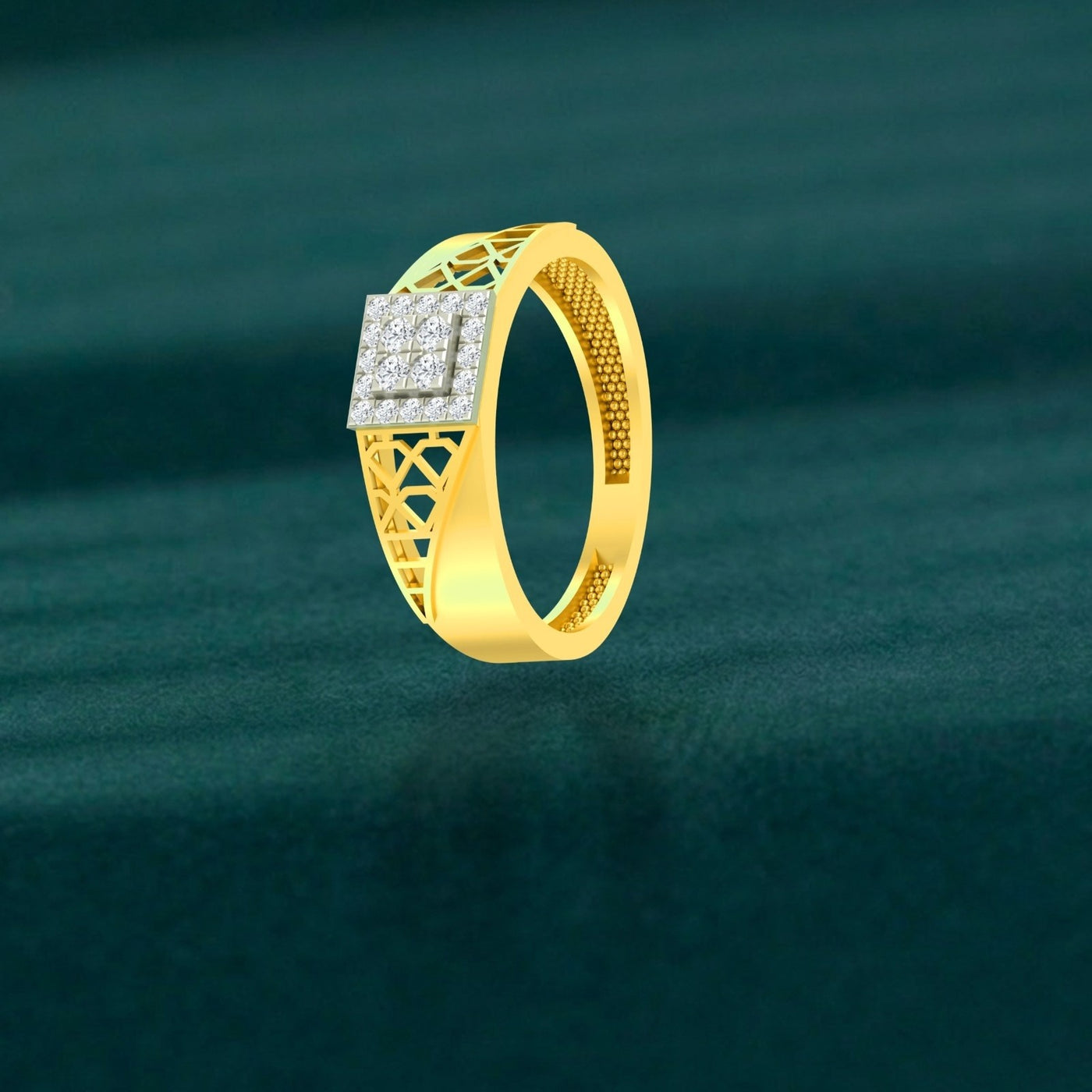 Gold ring with a square diamond cluster setting, on a teal surface.