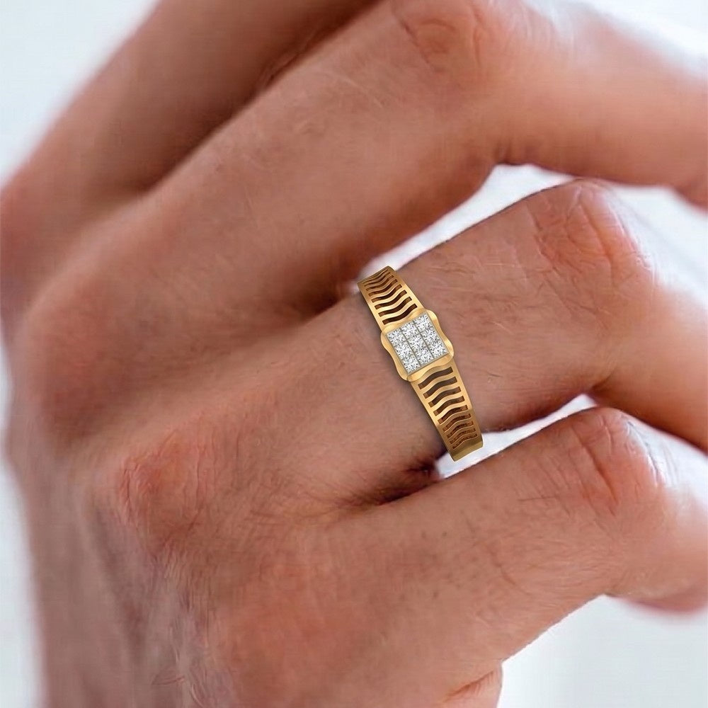 Gold ring with a diamond on a person's finger against a white background.