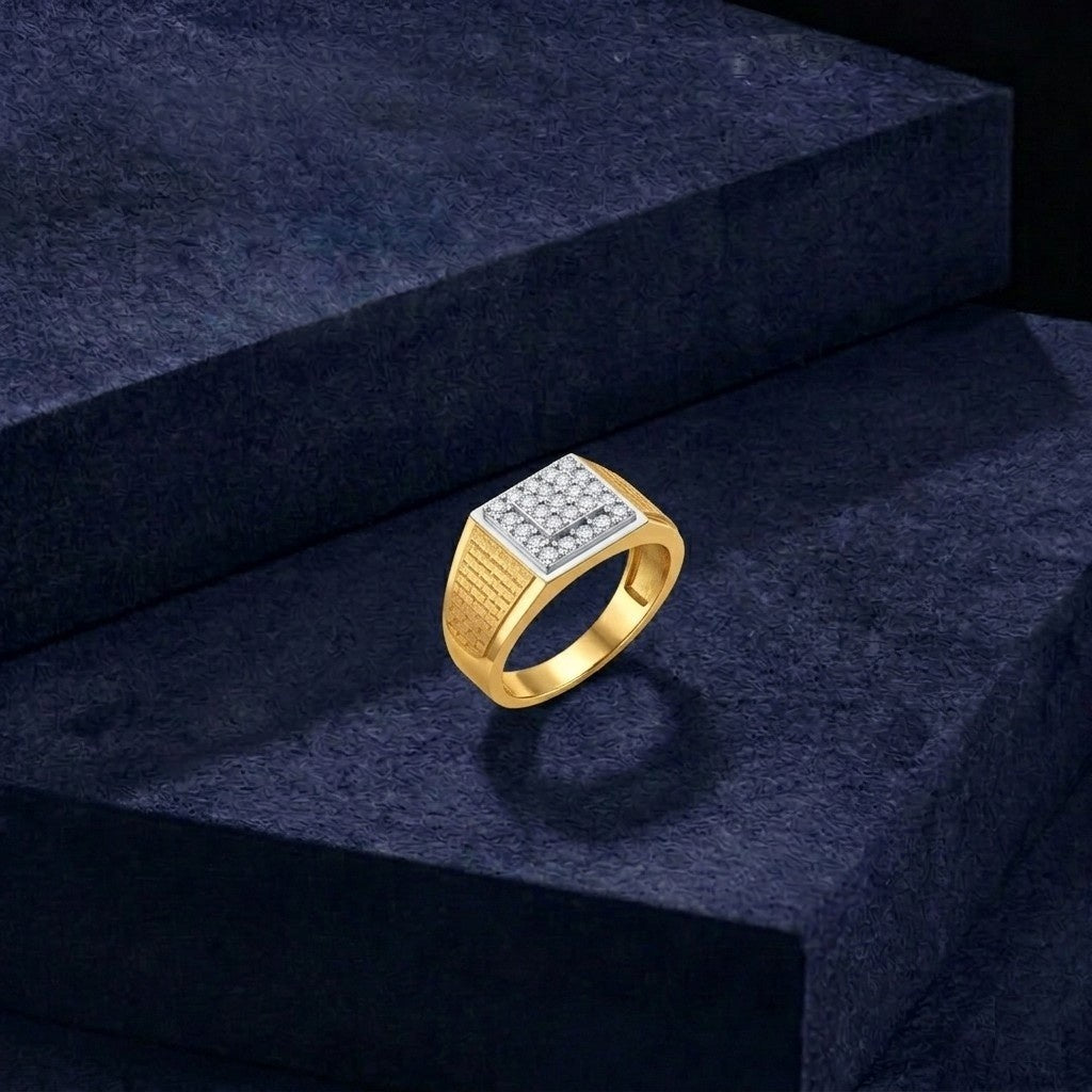Gold ring with diamonds on a dark blue textured surface