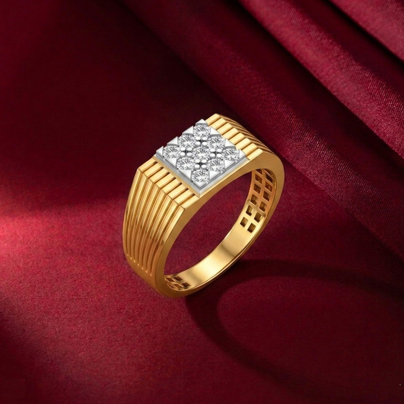 Gold ring with diamond-studded center on a red fabric background.