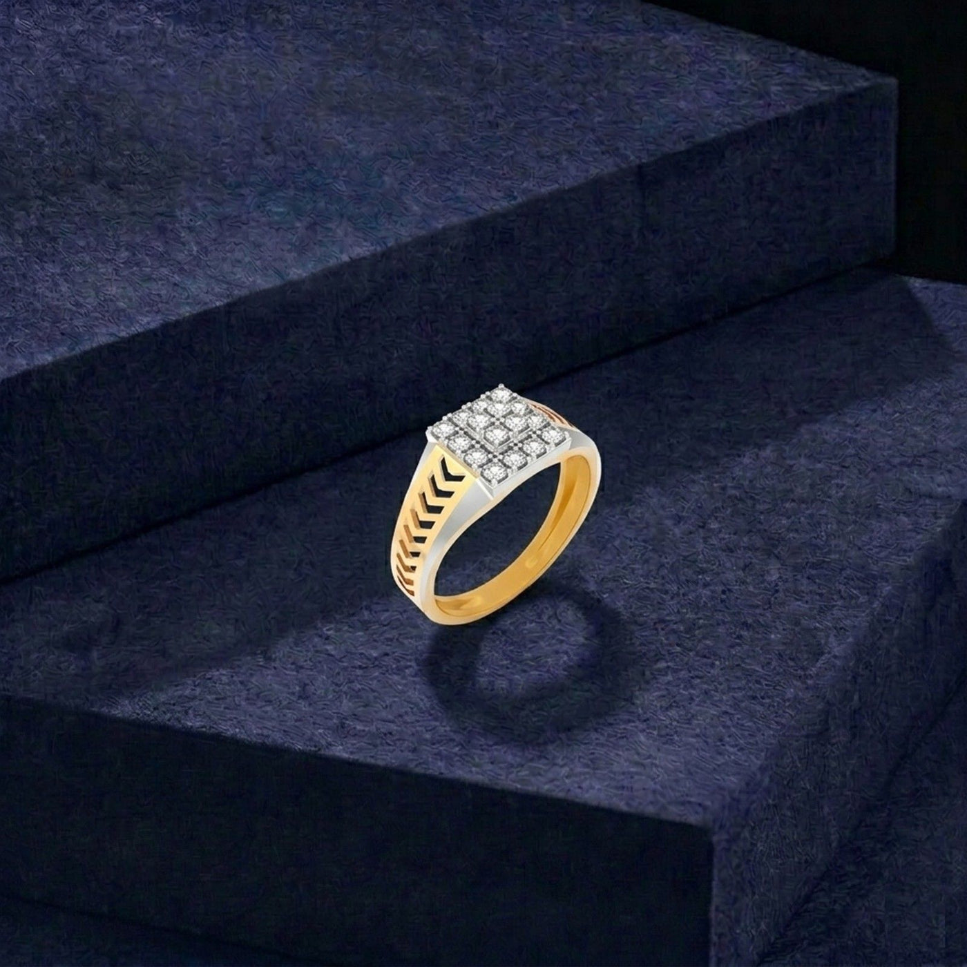 Gold ring with diamonds on a dark blue surface