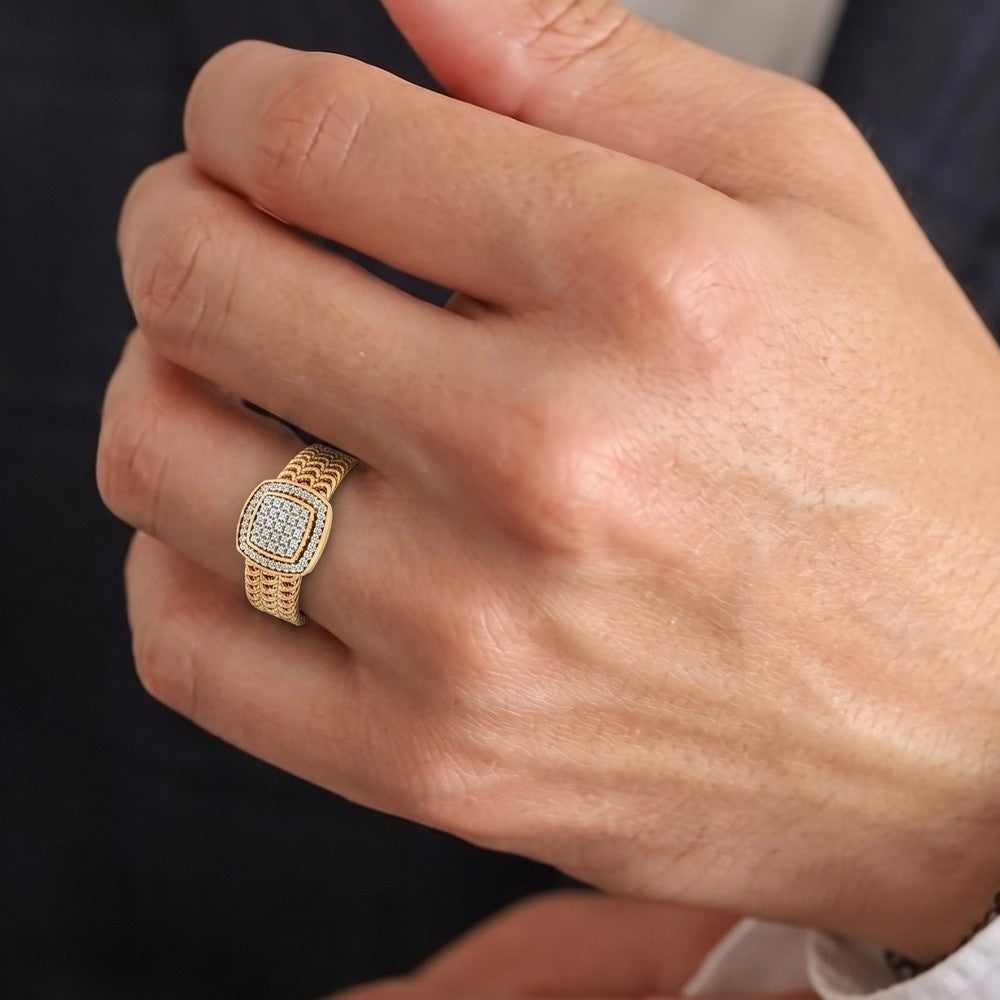 Close-up of a hand wearing a gold ring with a dark background