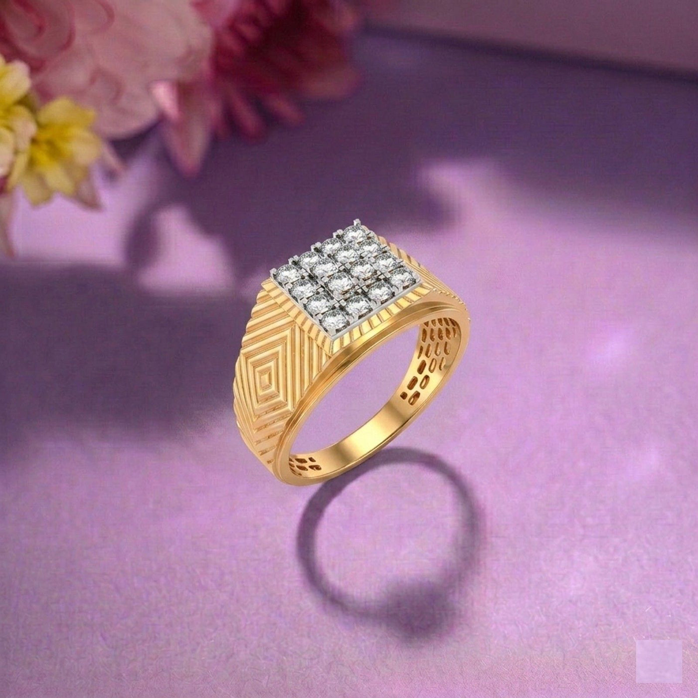 Gold ring with diamond accents on a purple surface with flowers in the background