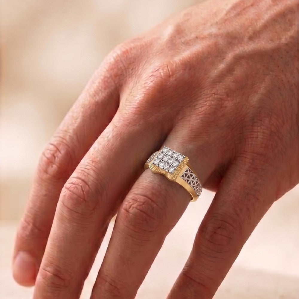 Gold ring with diamonds on a person's finger against a blurred background.