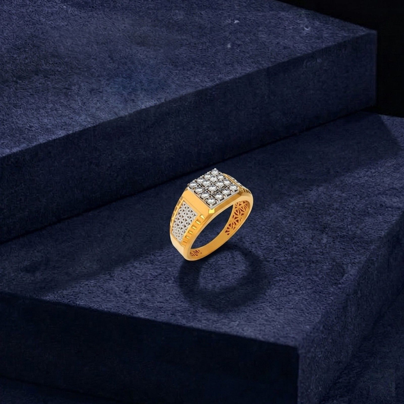 Gold ring with diamond on a dark blue textured surface