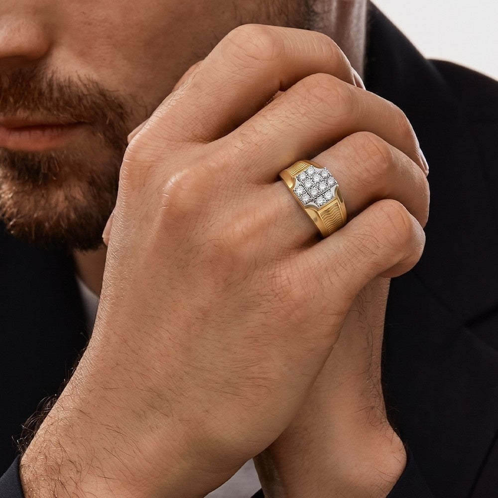 Close-up of a man's hand wearing a gold ring with a diamond design.
