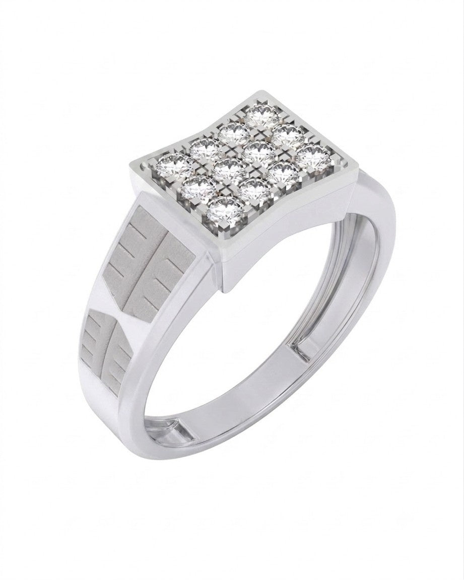 A white gold band with geometric channel detailing, on a white surface.