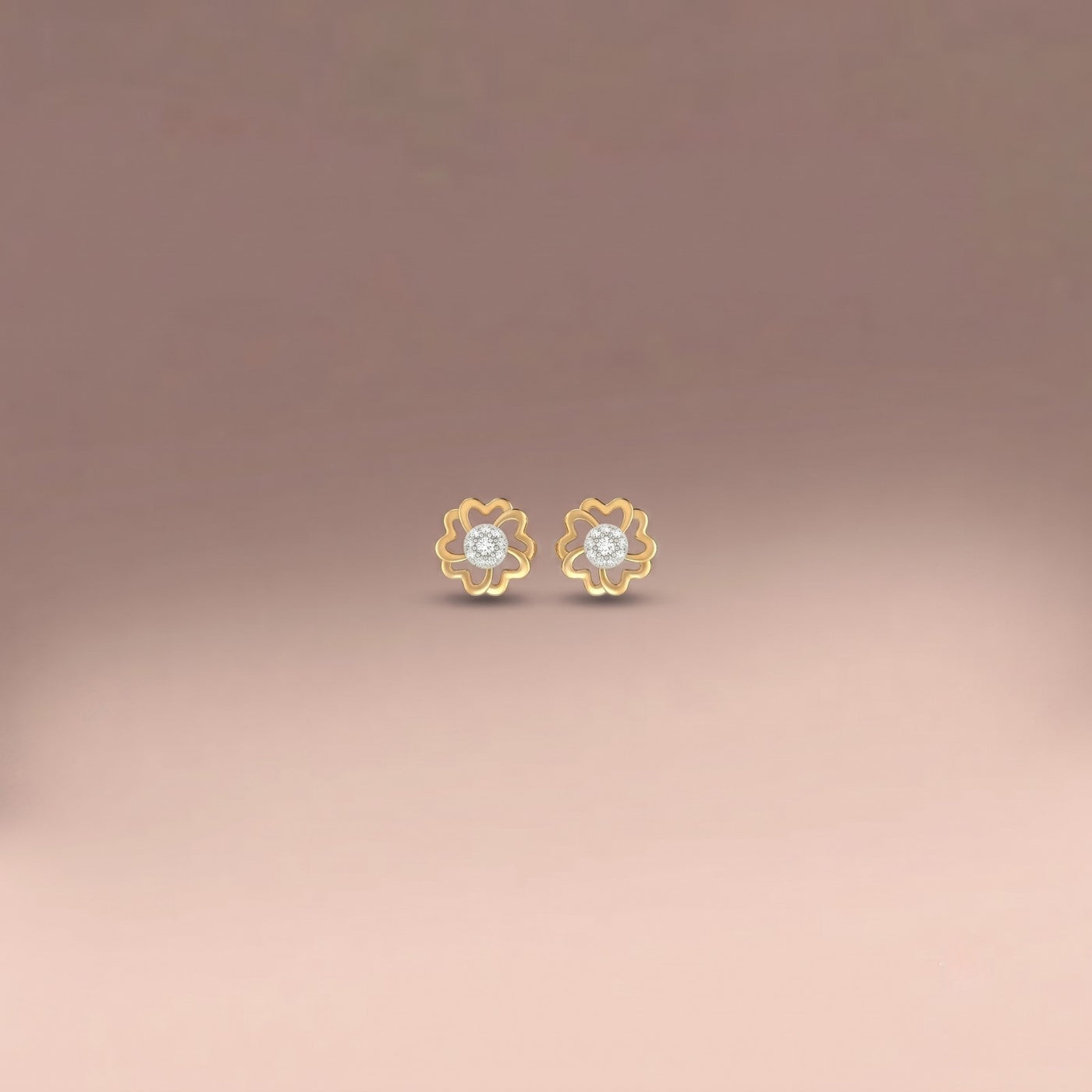 Gold and diamond floral stud earrings  on a gradient background.