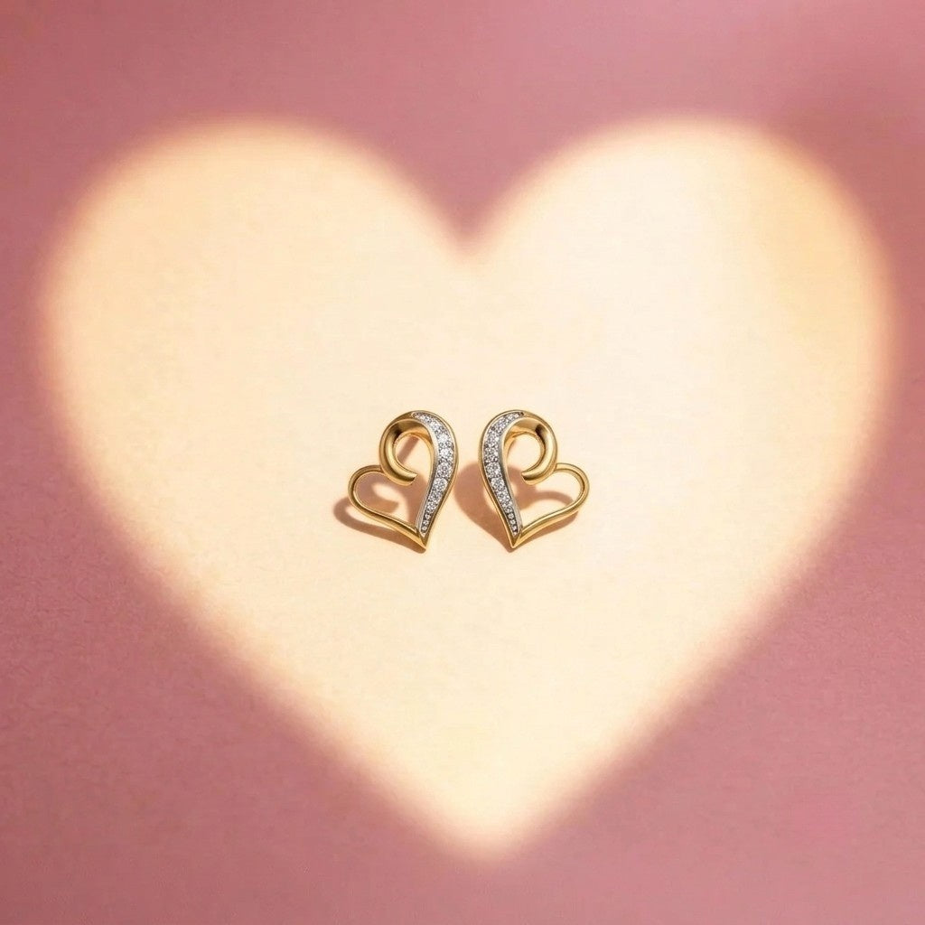 Gold and diamond heart-shaped stud earring on a pink background with heart-shaped light.