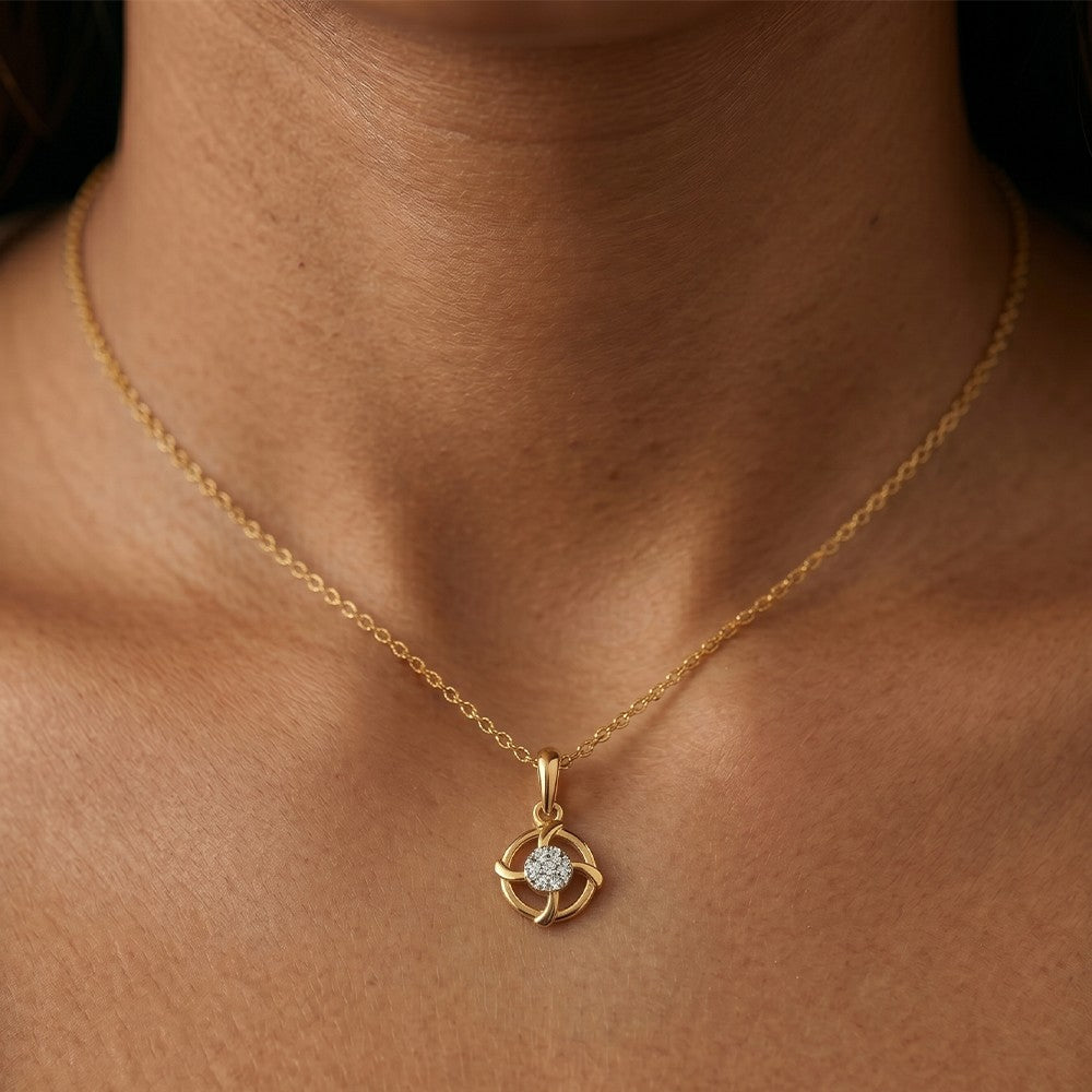 Gold and diamond pendant on a women neck.