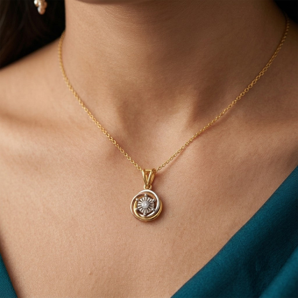 Gold and diamond tri-colour pendant on person neck.