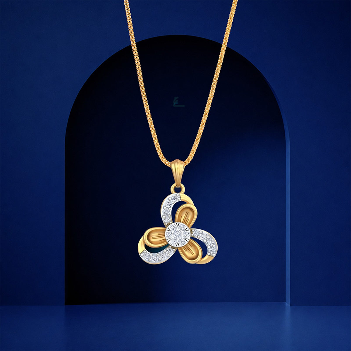 Gold and diamond pendant on blue background