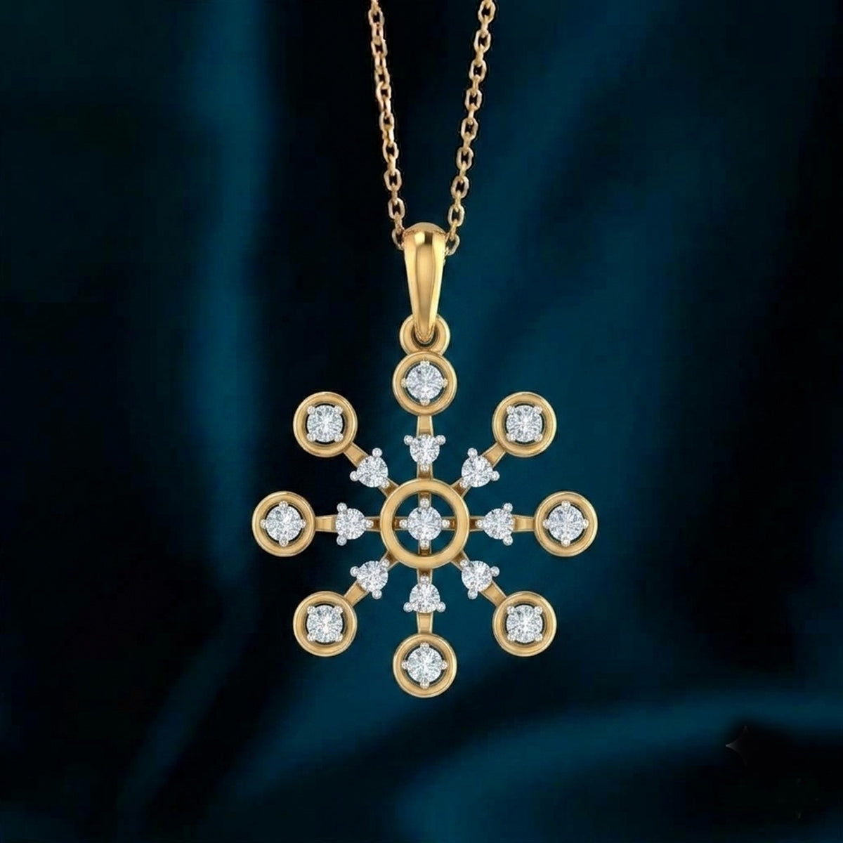 Gold snowflake pendant necklace on a blue fabric background