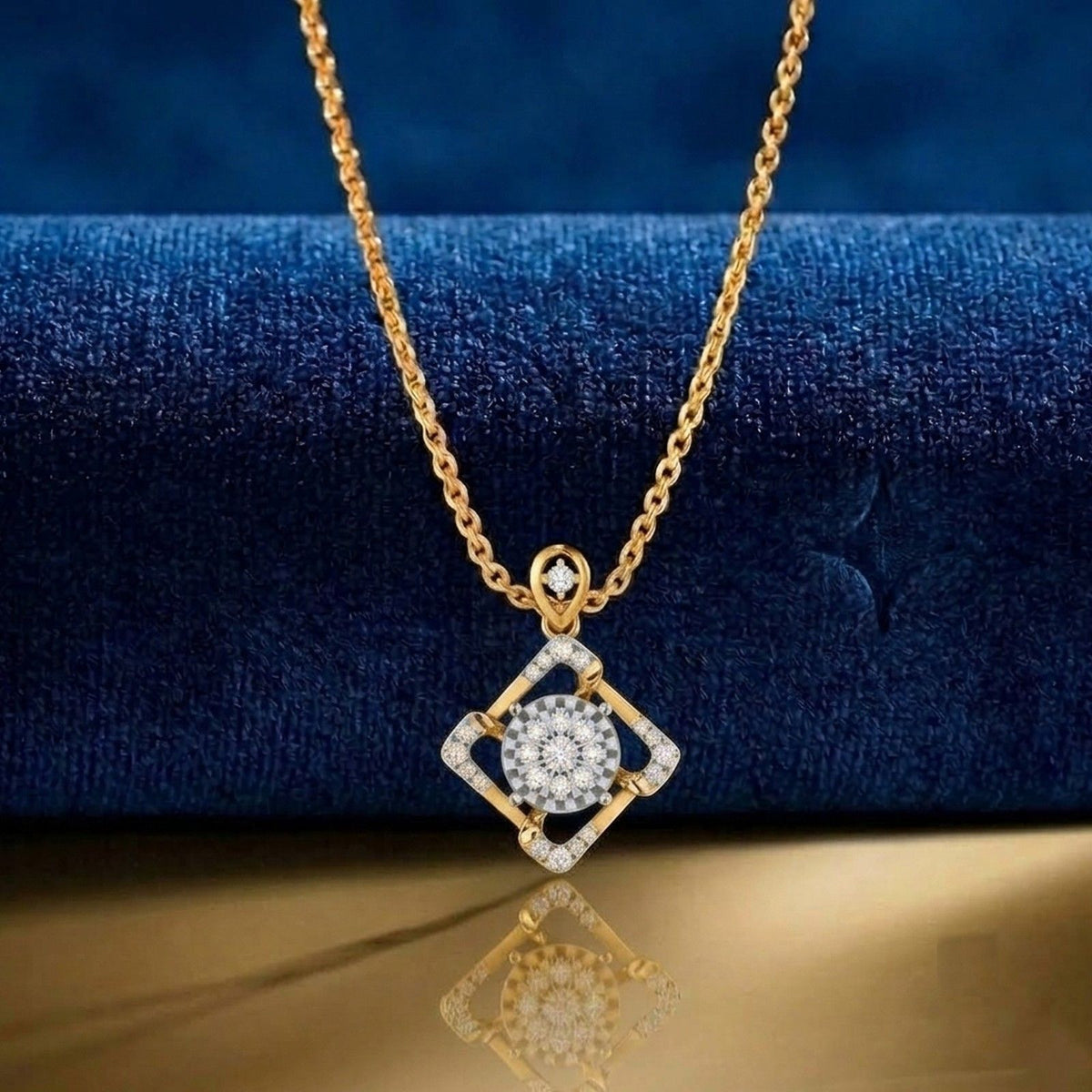 Gold and diamond pendant on blue background