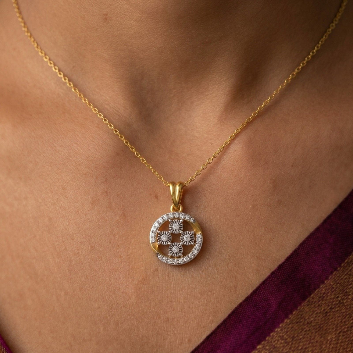 Women wearing gold and diamond circular design pendant