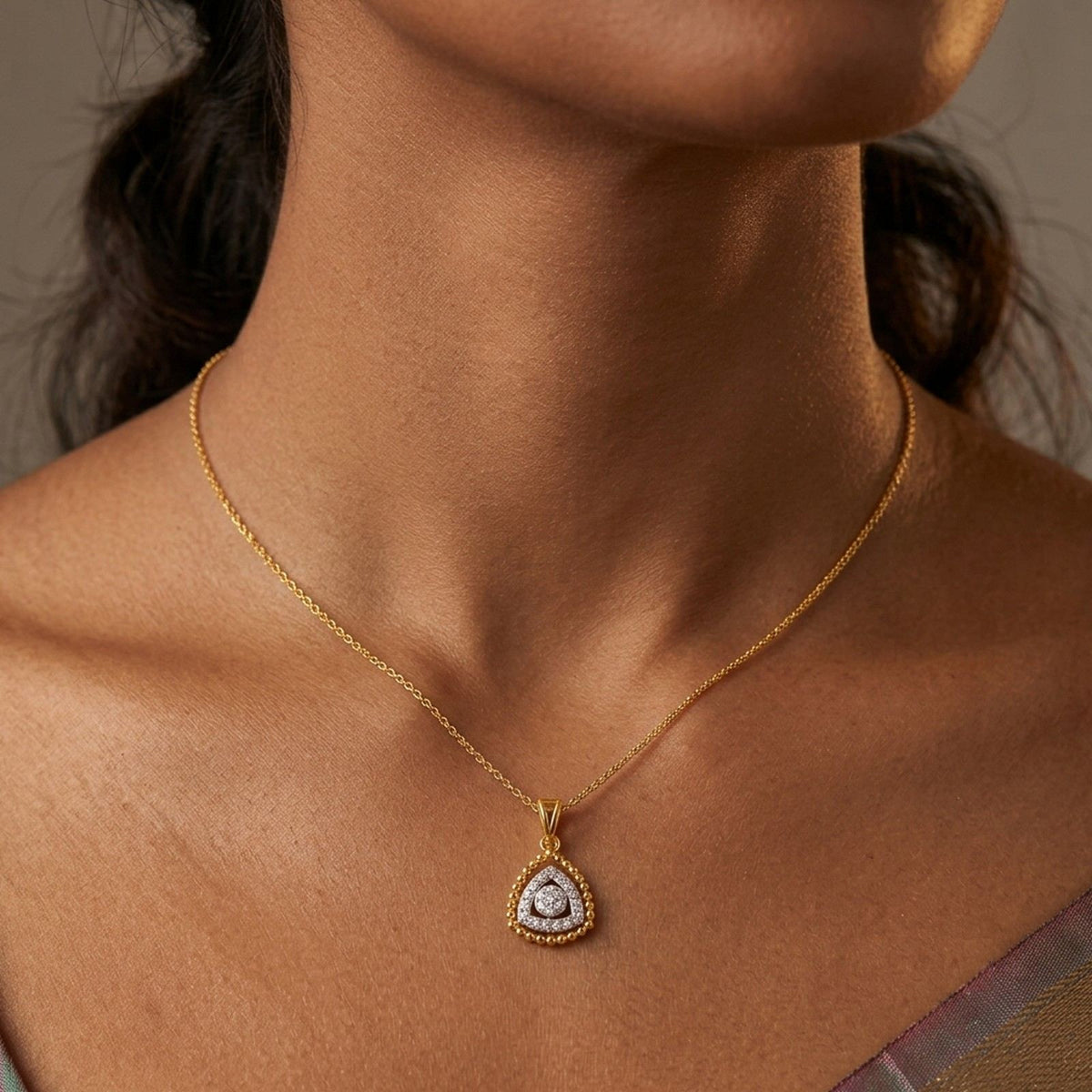 Women wearing gold and diamond partywear pendant