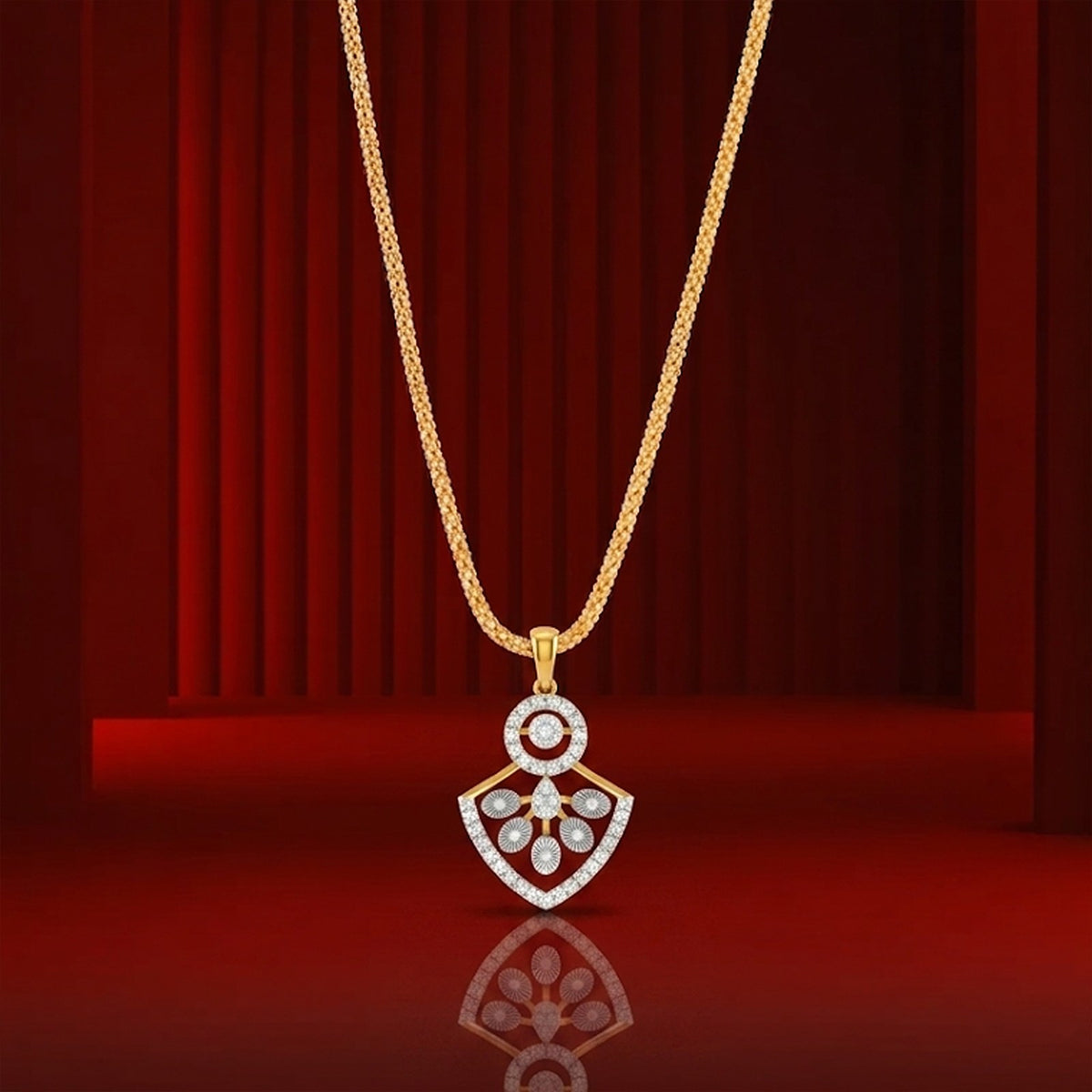 Gold and diamond partywear pendant on red background