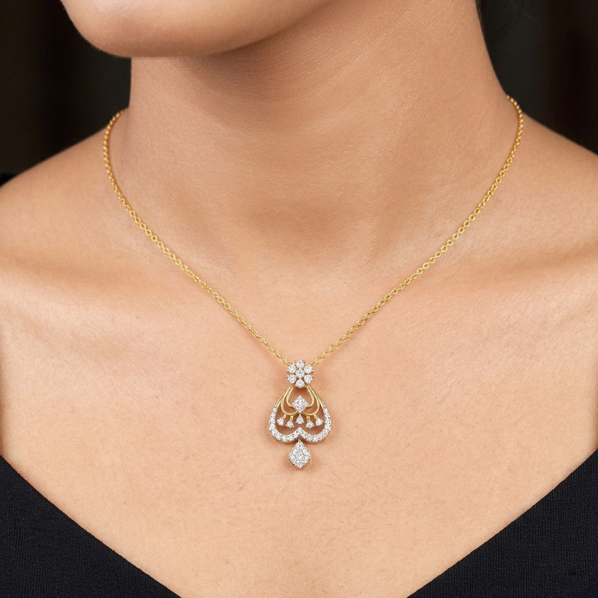 Women wearing gold and diamond pendant 