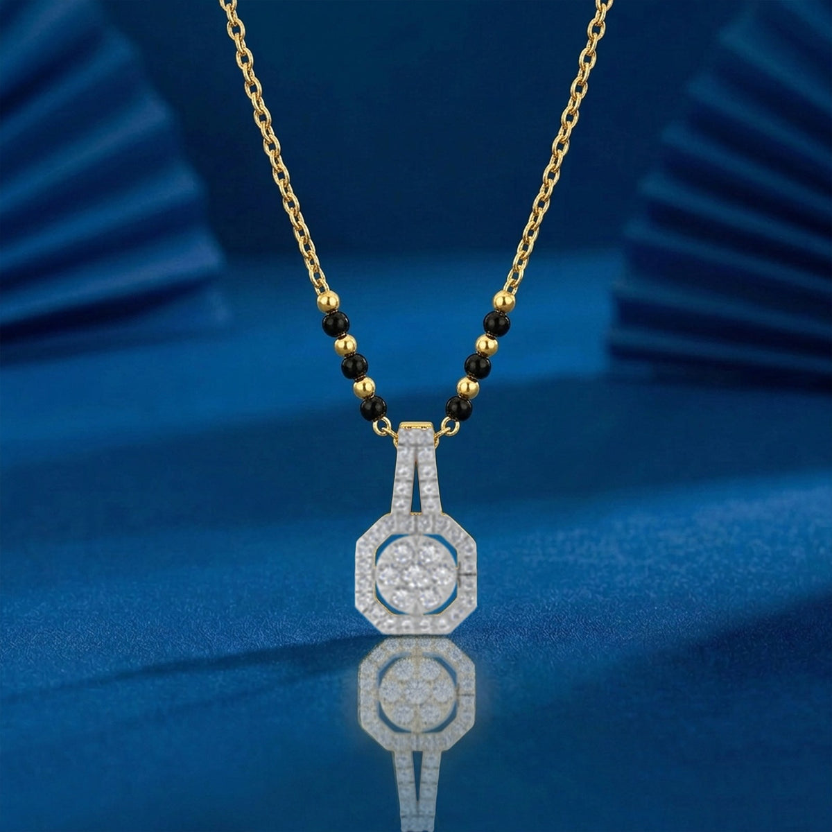 gold & diamond modern mangalsutra on blue background