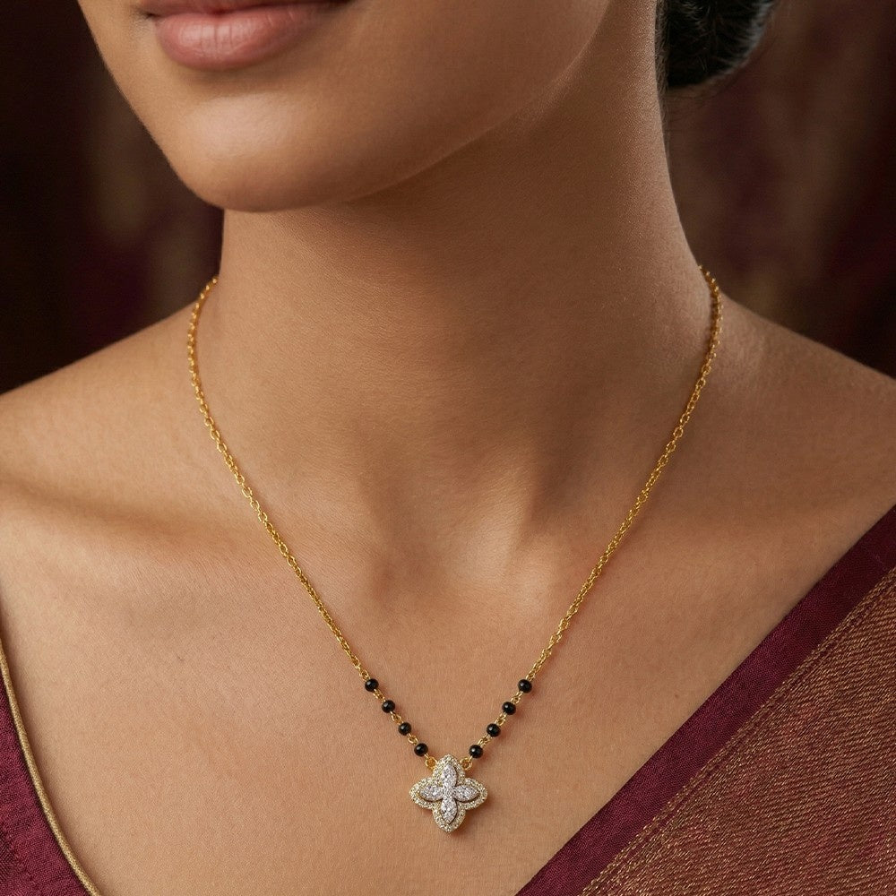 Gold and diamond mangalsutra  with a star-shaped worn by a model