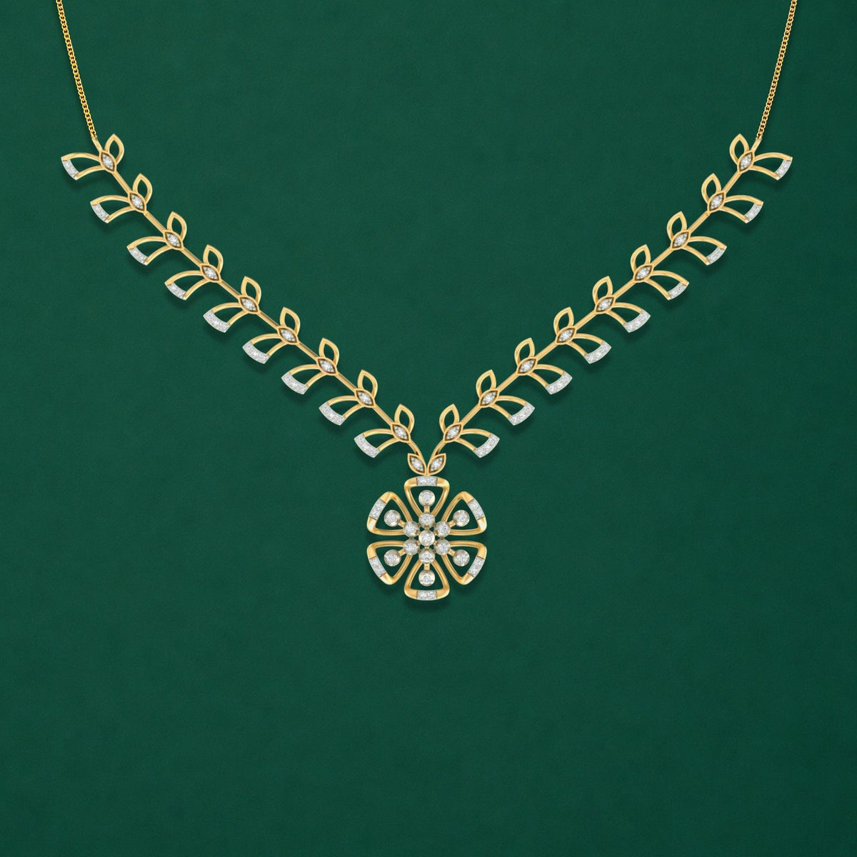 Gold and diamond necklace with floral pendant on a dark surface
