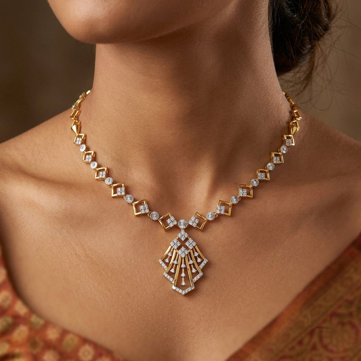 A close-up of a woman's neck and wearing a gold and dimaond necklace.