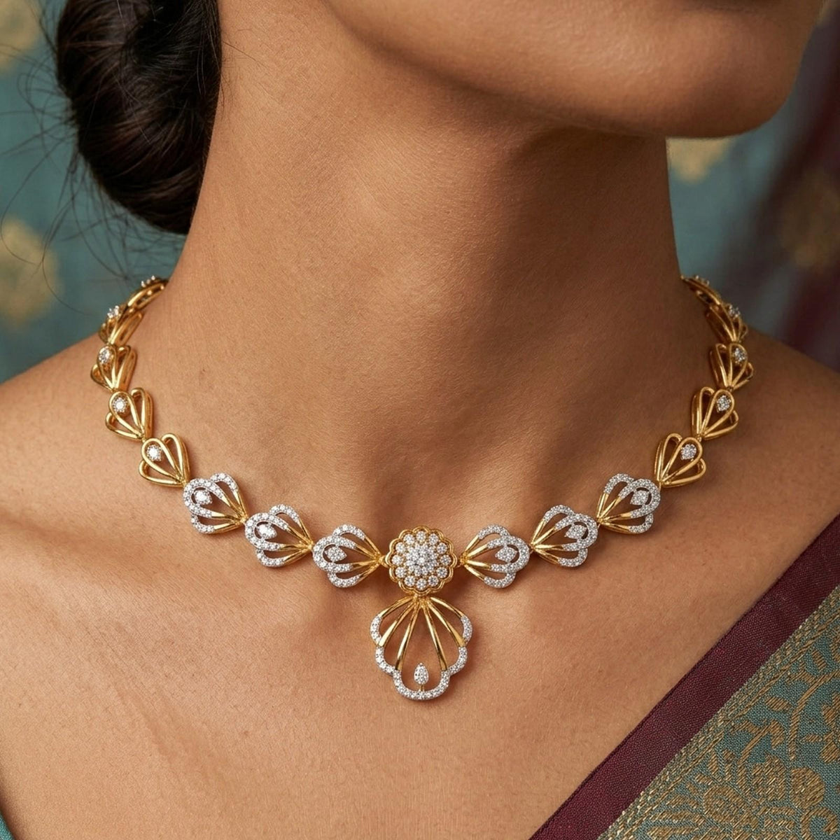 A close-up of a woman's neck wearing an gold and diamond necklace with a central floral motif.