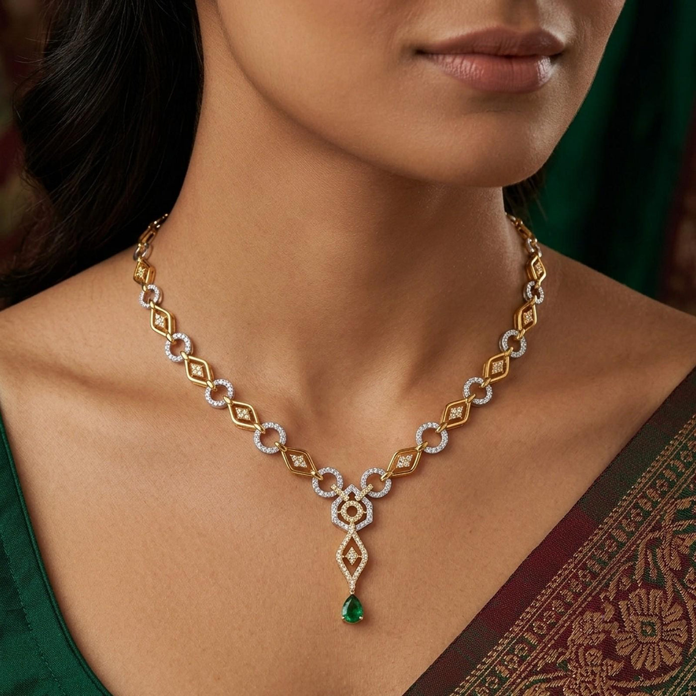 Gold and diamond traditional necklace with green teardrop, worn on a model's neck.