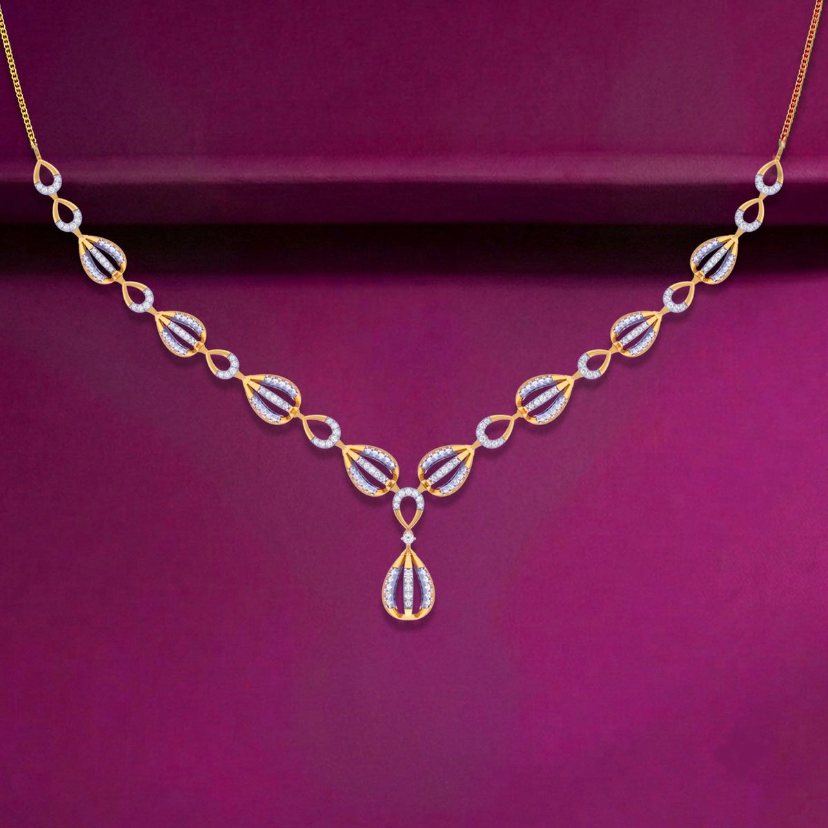 Gold and diamond necklace arranged in teardrop and oval motifs, featuring a central teardrop pendant, displayed against a deep magenta background.