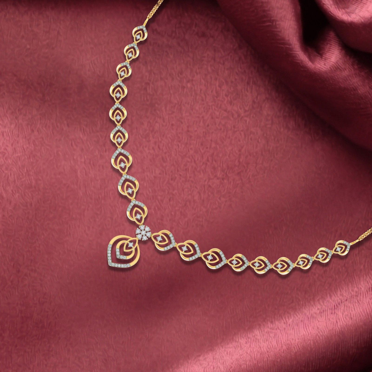 Gold and diamond necklace, displayed on a red background.
