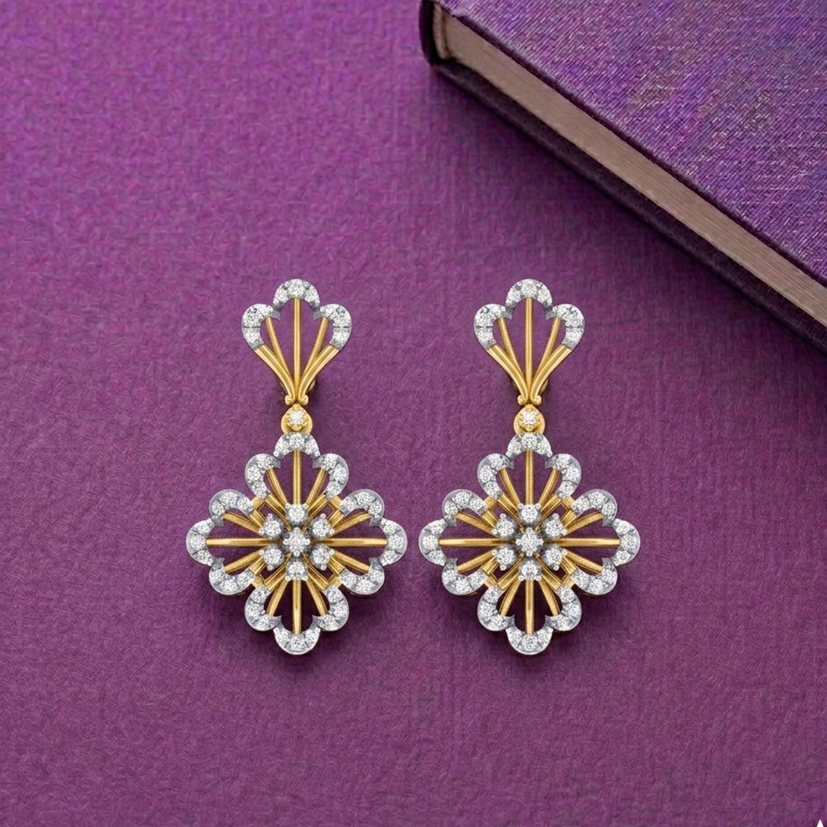Gold and diamond floral-shaped earrings on a purple background.