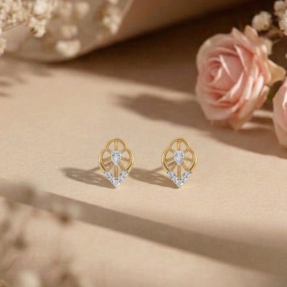 Gold and diamond floral stud earring on a beige background.