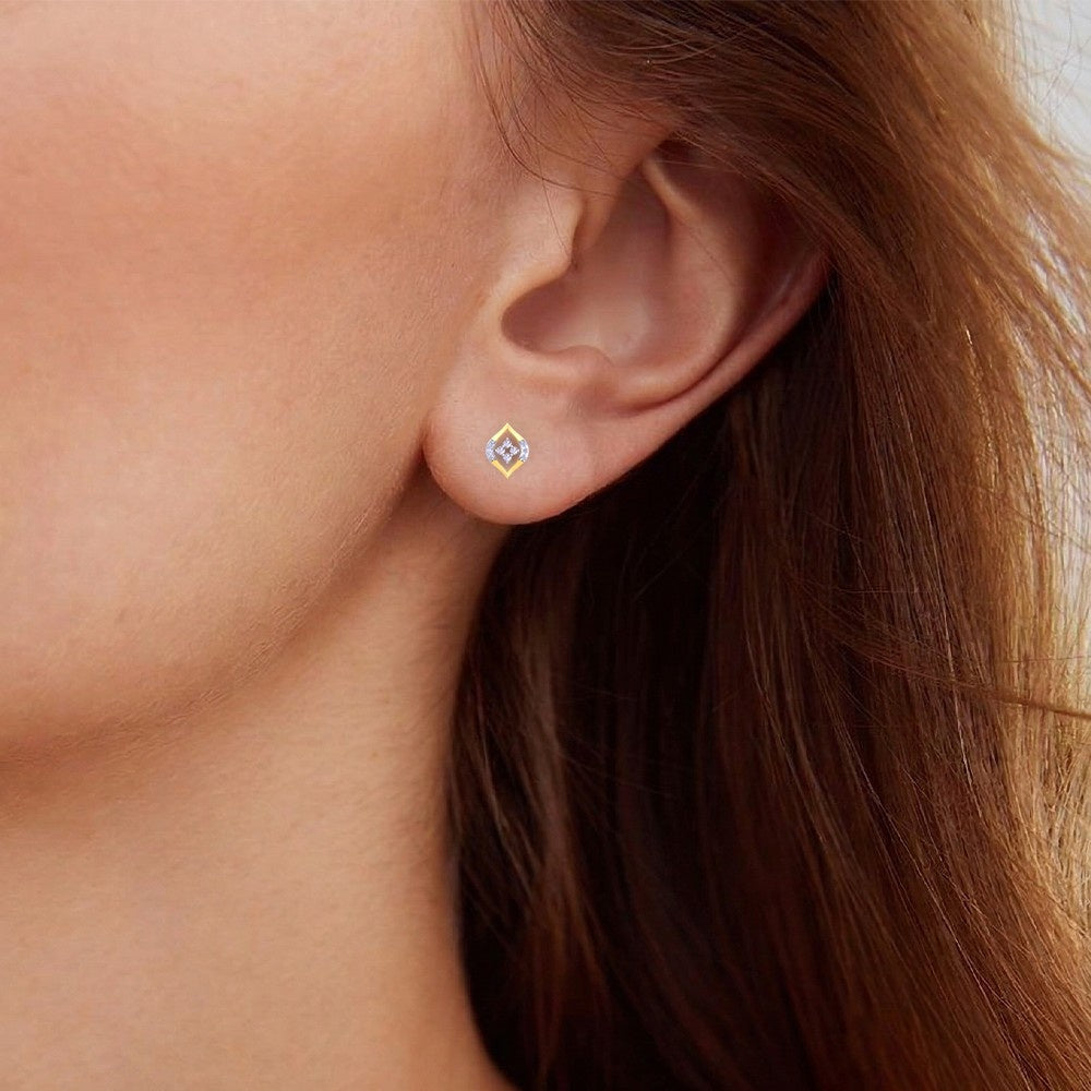 Close-up shot of a gold and diamond stud earring