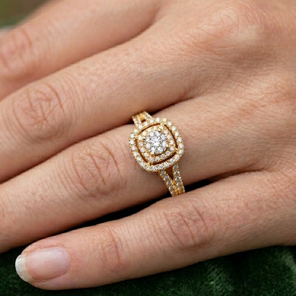 Yellow gold ring with a diamond on a person's finger