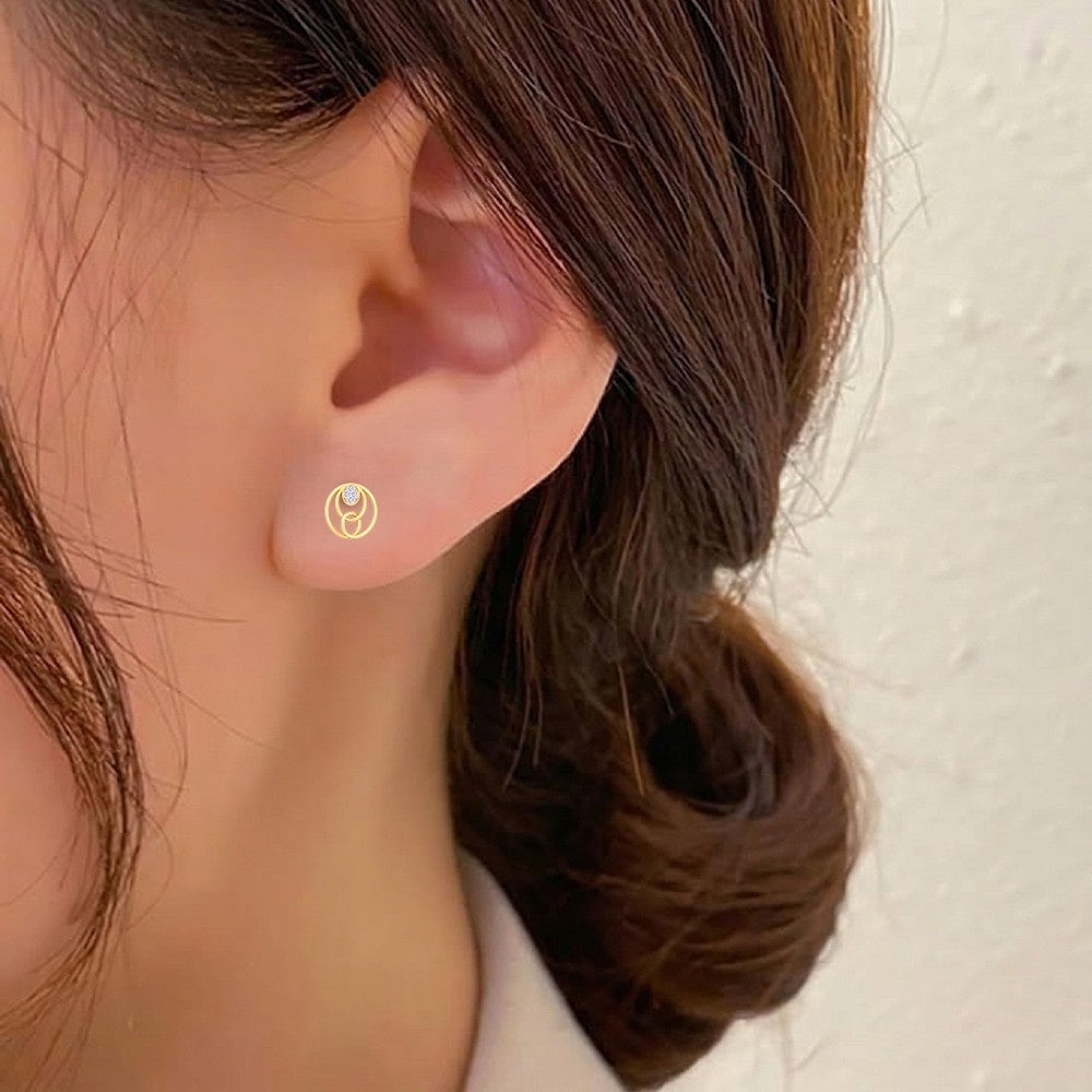 Close-up shot of a round-shaped stud earring.