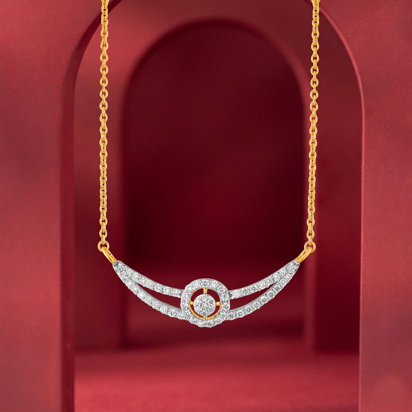 A gold chain mangalsutra with a curved, wing featuring paved diamond bands and a central circular diamond halo, displayed against a deep red arched background