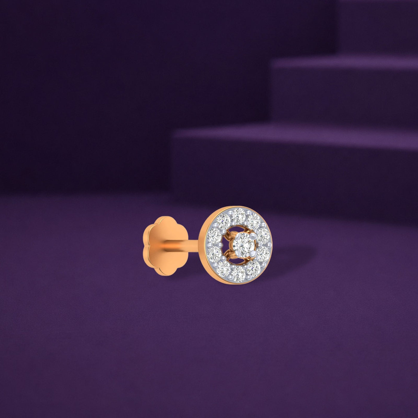 Yellow gold and diamond stud nosepin with gemstones on a purple background