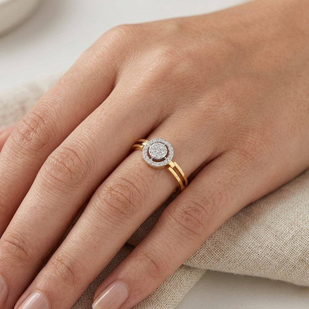 Gold ring with a diamond on a hand against a neutral background
