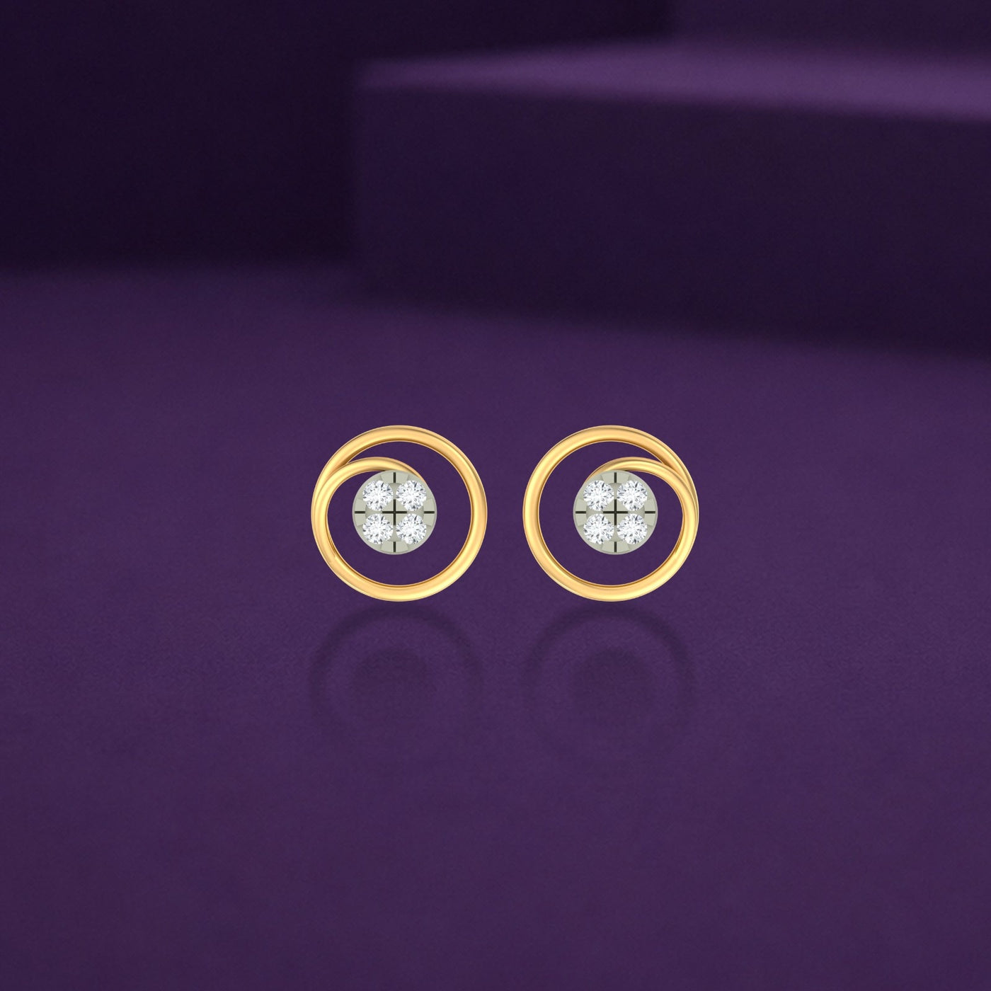 Gold and diamond stud earrings with circular design on a purple background