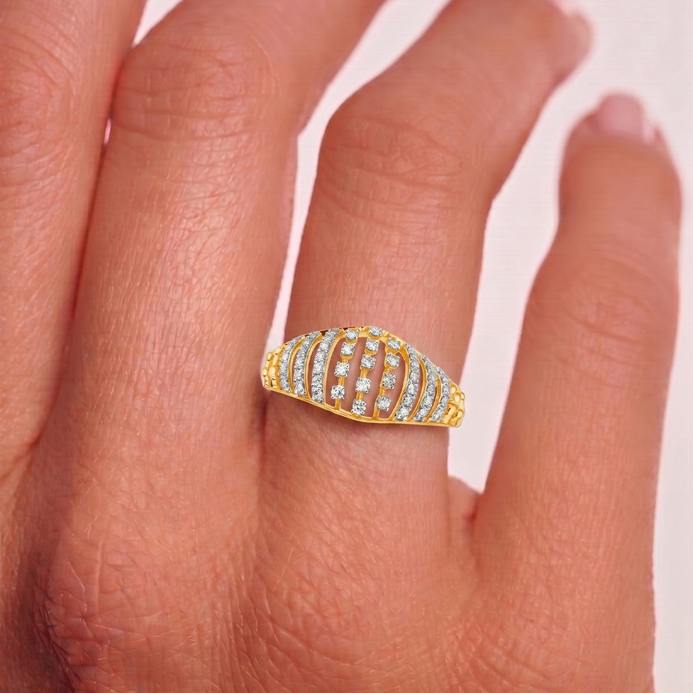 A gold ring with multiple rows of clear pavé stones worn on a finger, shown in a close-up lifestyle shot.