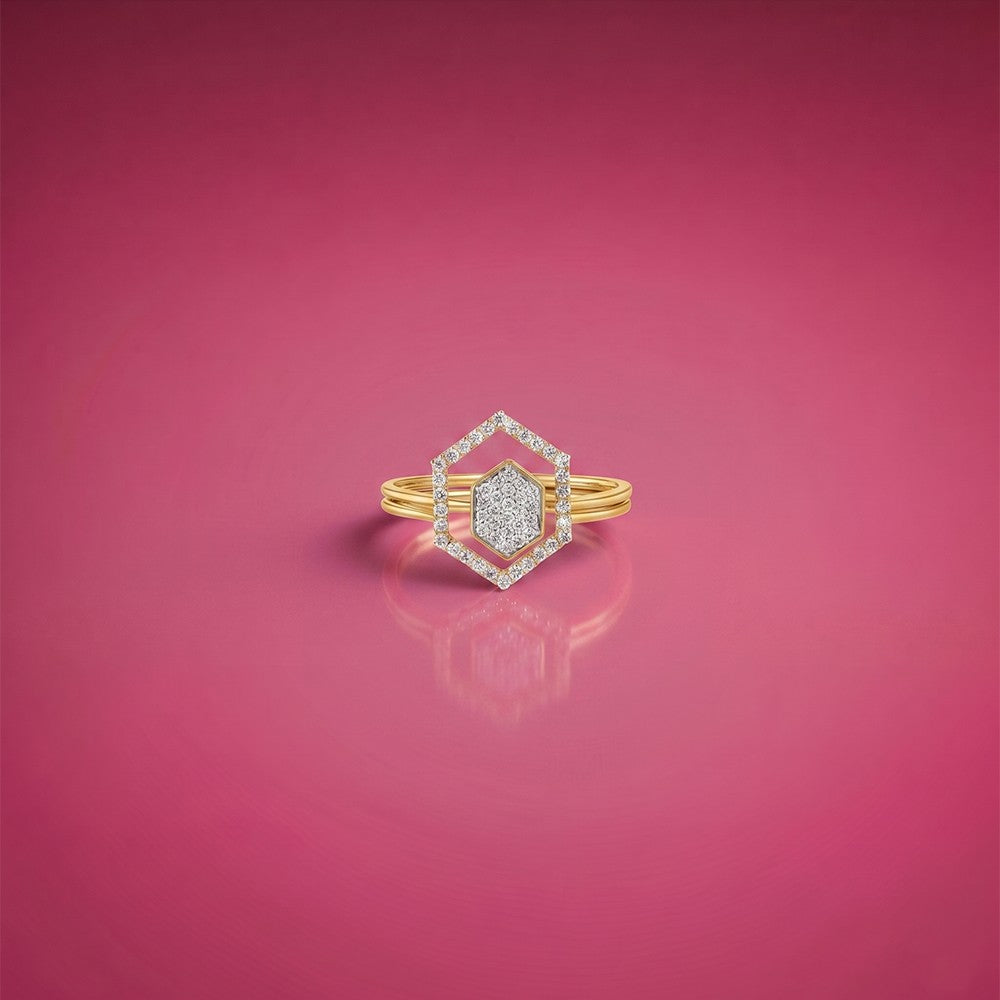 Gold and diamond with Hexagon-shaped cluster setting on a pink surface.