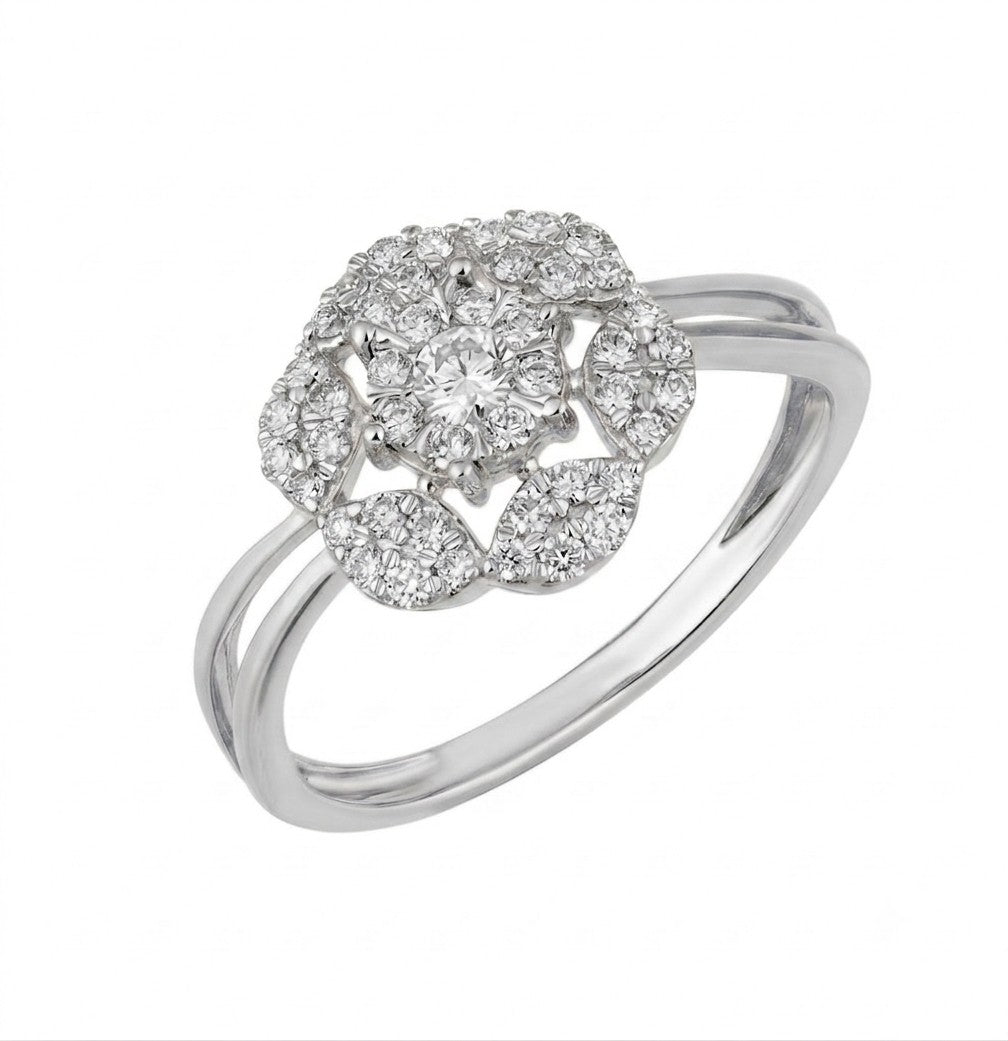 A white gold ring featuring a floral-shaped cluster of pavé diamonds, set against a plain white background.